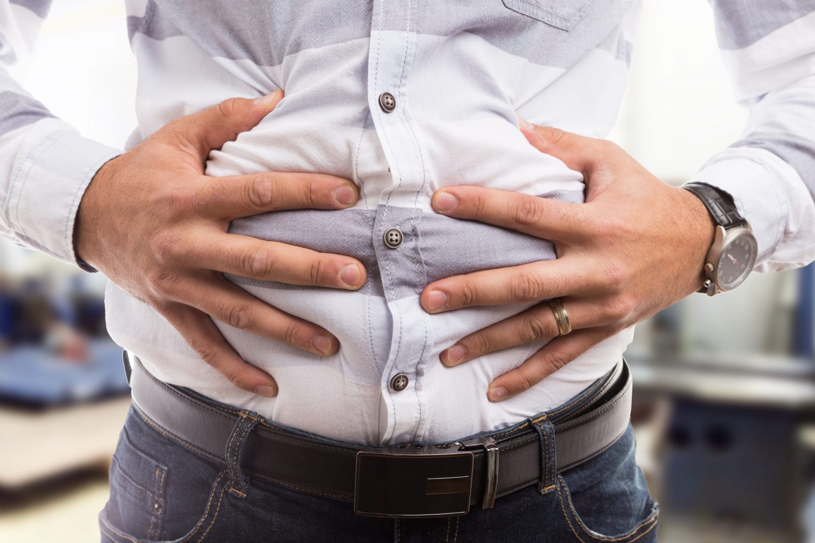 man holding stomach