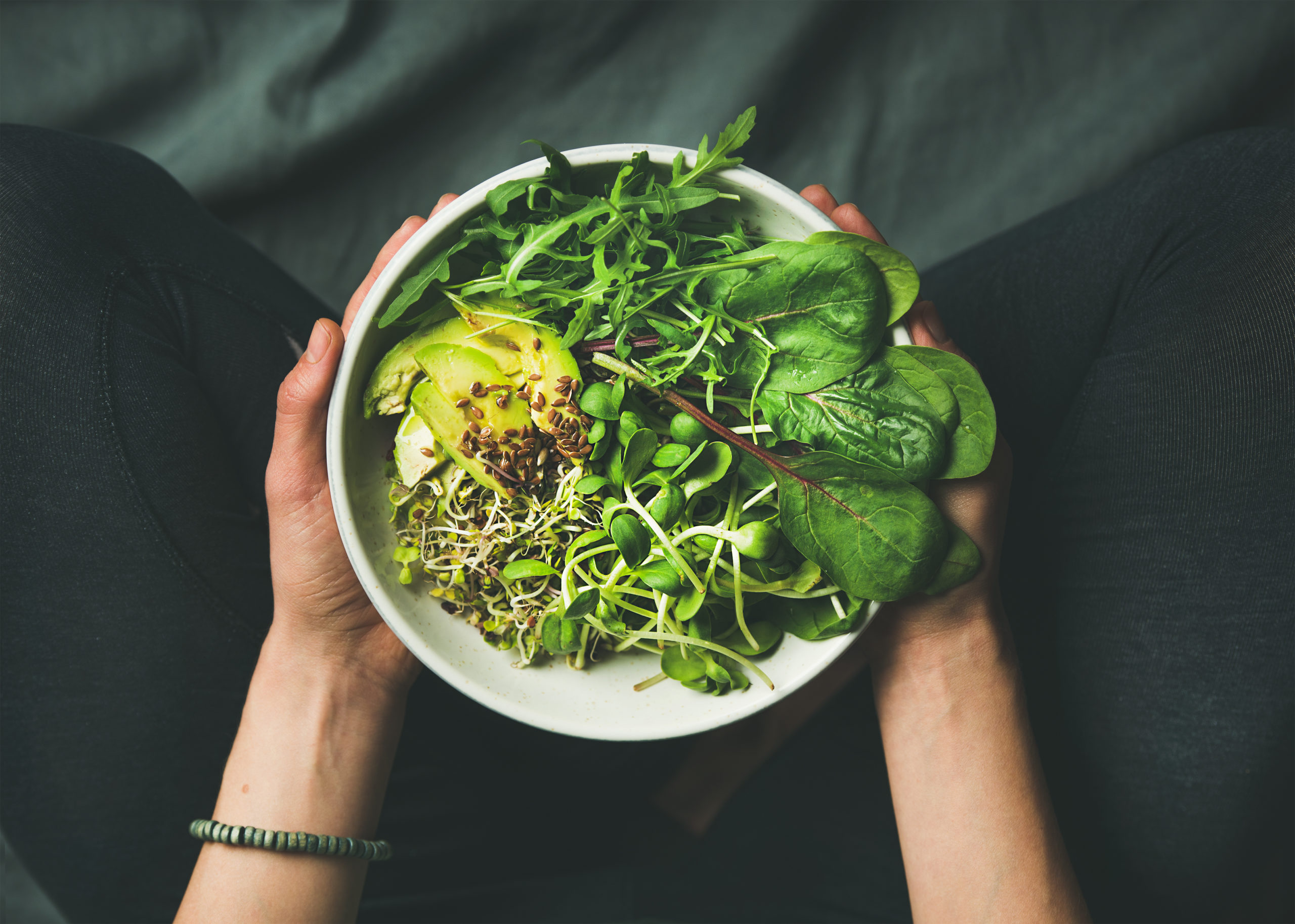 Plant-based meal in a bowl being held.